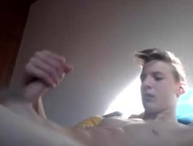 halsome blond boy stroking his big tool