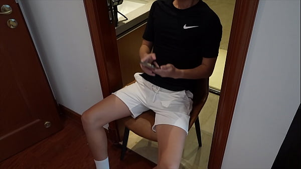 Twink boy masturbates with a cup